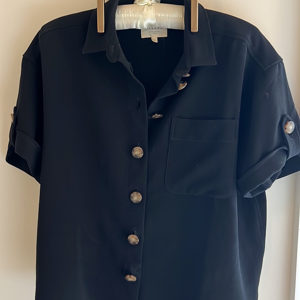 Sezane Small button down blouse in black. Lightly used. Fit is loose.